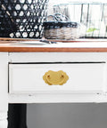 Vintage Brass Drawer Handles Two Hole for Chinese Style Furniture installed on a white drawer in a room scene.