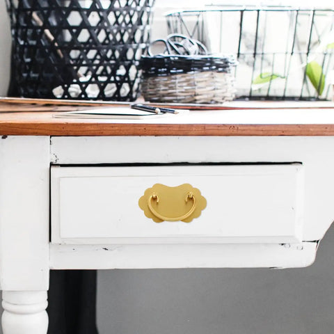 Vintage Brass Drawer Handles Two Hole for Chinese Style Furniture installed on a white drawer in a room scene.