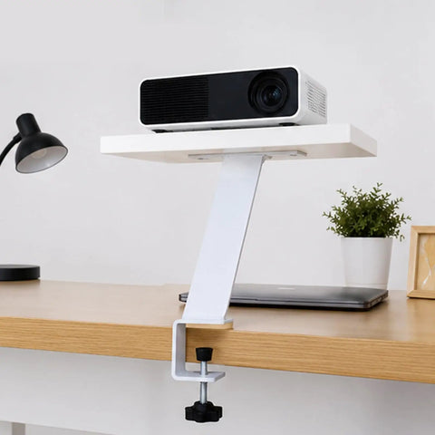 White angled iron table leg clamped on desk with shelf, Adjustable Iron Table Leg For Desk Height Increase And Ergonomic Setup.
