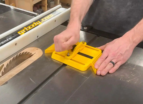 Adjustable Magnetic Featherboard For Table Saws And Router Tables Locks Stock Dead Tight Against Fence securing a wood piece on a table saw.