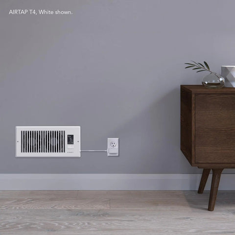 4x12 Register Booster Fan With Bluetooth App Control installed in wall vent, white color, in a living room setting