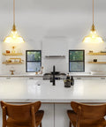 Modern Brass Pendant Light For Kitchen Island With Hand Blown Glass Shade, Farmhouse Style Ceiling Fixture above a white kitchen island
