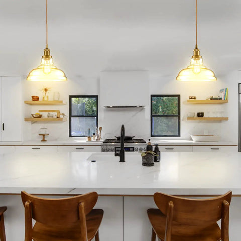 Modern Brass Pendant Light For Kitchen Island With Hand Blown Glass Shade, Farmhouse Style Ceiling Fixture above a white kitchen island