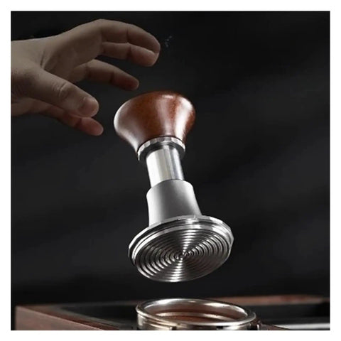 Automatic Spring Loaded Coffee Tamper With Integrated Powder Distributor in hand, showcasing durable metal and wooden design.