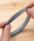 8 Pack Rubber Water Bottle Seal Replacement For FreeSip 19oz 24oz 25oz 32oz 40oz Lids Gaskets O Ring Set Silicone BPA Free Leak Proof Direct Replacement For Leaky Or Worn Seals. Grey silicone gasket ring held by fingers