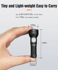 Hand holding GT Nano Keychain Flashlight Tiny Powerhouse With 450 Lumens 300 Meter Beam Distance About 2 Inch Length, black