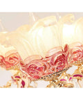 Stunning European Crystal Chandelier Featuring Pink Flower Accents Warm Led Ceiling Pendant Light Luxe Fixture For Living Room Or Hotel With Adjustable Chain To Slay Your Space Decor close-up of pink floral accents and light shades