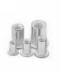 Get This Ultimate 50 Piece Kit Of Flat Head Threaded Insert Nuts In Aluminum For M3 To M12 Sizes showing various sizes of silver aluminum nuts.