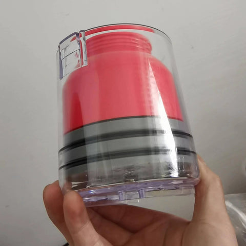 Close-up of Hand Bearing Packer And Wheel Bearing Packer Tool, Portable Self Contained Grease Repack System, clear and red design.