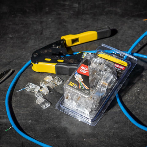 RJ45 Cable Tester Kit With LAN Scout Jr 2, coax crimper, and 50-pack modular data plugs with backlit LCD for CAT5e, CAT6, CAT6A cables.