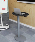 Heavy Duty Pneumatic Lectern With Smooth Height Adjustment Mobile Presentation Podium featuring a black top and silver base in an office setting.