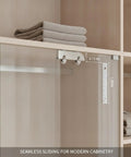 Heavy Duty Sliding Door Track System For Frameless Cabinets Built With Cold Rolled Steel Rails And Premium Stainless Steel Casters For Kitchen Renovations. Close-up view of installed track with glass door.