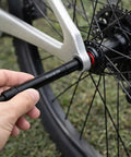 12mm To 9mm Thru Axle Quick Release Hub Skewer Adapter For Mountain And Road Bikes, Lightweight Aluminum Alloy Conversion From 12mm Rear Hub To 9mm Quick Release, No Fuss Easy Install being inserted into bike wheel