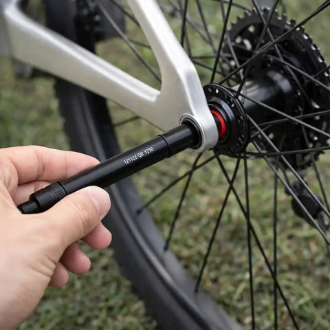 12mm To 9mm Thru Axle Quick Release Hub Skewer Adapter For Mountain And Road Bikes, Lightweight Aluminum Alloy Conversion From 12mm Rear Hub To 9mm Quick Release, No Fuss Easy Install being inserted into bike wheel