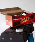 Open box of 2 Inch Sealed Nylon Garage Door Roller With 6200ZZ Bearing Quiet Operation Pack Of 10 on ladder