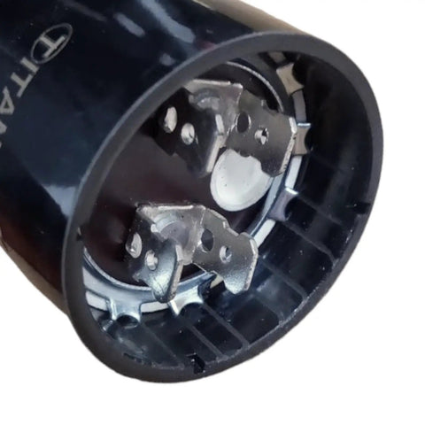 Beef Up Your AC Motor With This Dry Electrolytic Start Capacitor, 53-64 Microfarads, 330 VAC, One Quarter Inch Male Terminals, Built Tough For Industrial And Home Use In Intermittent Motor Starting, black cylinder with spade terminals