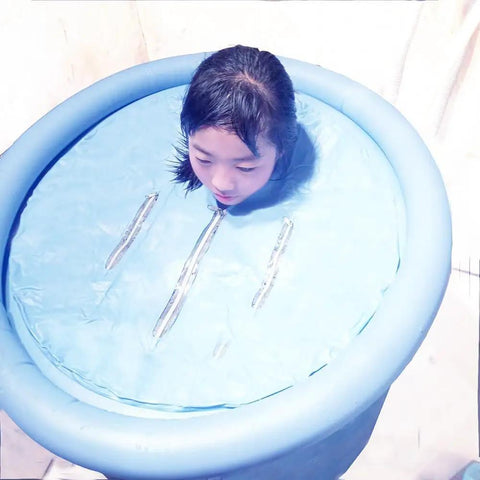 Person using Inflatable Portable Bathtub For Adults Foldable Soaking Spa Tub Ice Bath And Cold Plunge For Athletes Sky Blue 29.5 Inch