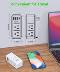 Transforms One Outlet Into Six With Rotating Plug And USB Ports 1700J Surge Protector next to phone and laptop on desk