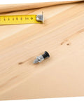 Heavy Duty Stainless Steel Reset Spring Indexing Plunger With Knockout Self Locking Grip on wooden surface next to measuring tape.