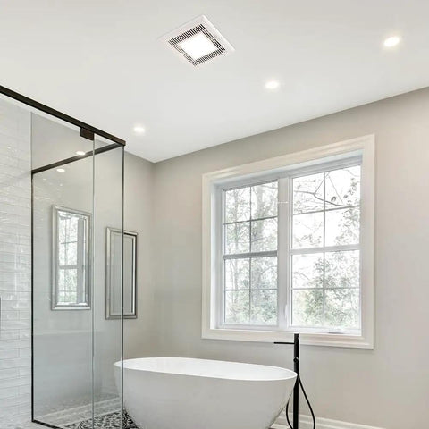 Slim 70 CFM Bathroom Exhaust Fan With LED Light 3000K Warm White 600 Lumen installed in elegant bathroom ceiling.