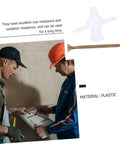 Two workers discussing plans with Heavy Duty Wall Anchors 100 Pack For Drywall And Plasterboard Fixings, screw and plastic anchor visible