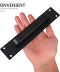 Black Exterior Door Handle Heavy Duty Barn Door Pull With Surface Mount Holes Universal Fit For Sliding Doors shown in hand