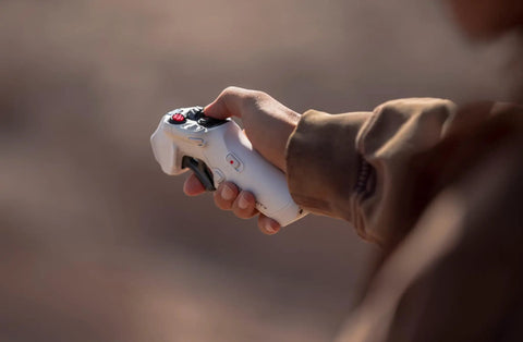 Person holding controller for 8K 360 Drone Explorer Bundle With Invisible 360 Capture And No Guardrails For Unreal Creative Freedom.