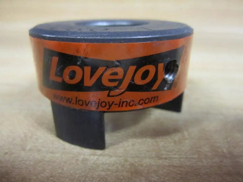 Jaw Coupling With 0.875 Inch Bore And 0.1875 Inch Keyway L-090.875 Model For Smooth Power Transfer In Industrial Machinery Durable Easy To Install Precision Fit For Reliable Drive System, orange and black jaw coupling with set screw