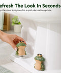 Slick Ceramic Frog Toilet Bolt Covers 2 Pack With Universal Screw Caps installed on toilet for quick bathroom update.
