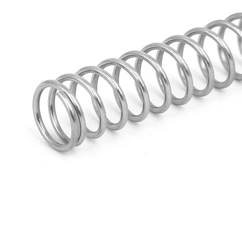 Close-up of a silver uxcell compression spring, 304 stainless steel, 8 mm OD.