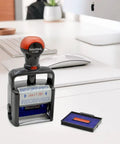 Heavy Duty Self Inking Date Stamp With Paid Message Smooth Zero Mess Action Crisp Blue And Red Ink Lightweight Office Essential Built Tough For The Daily Grind With Shielded Date Wheel on a desk with computer