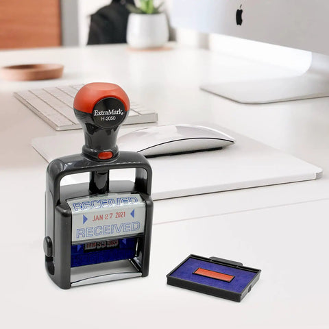 Heavy Duty Self Inking Date Stamp With Paid Message Smooth Zero Mess Action Crisp Blue And Red Ink Lightweight Office Essential Built Tough For The Daily Grind With Shielded Date Wheel on a desk with computer