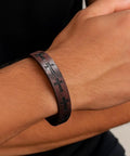 Premium Cross Woven Leather Bracelet Giving Sick Drip And Bold Flex on wrist with cross motifs and secure adjustable buckle.