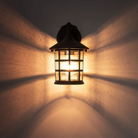 10 Inch Black Outdoor Coach Lights With Seeded Glass Shade Waterproof Patio Wall Lights on wall, glowing effect