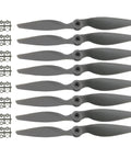 Eight Pack CCW Gemfan APC Nylon Propellers 9060 For RC Airplanes With Adapter Rings, shown with propellers and adapters