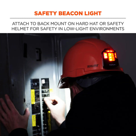 Skullerz 8993 Hard Hat Safety Light, magnetic mount, four-direction beacon, attached to helmet in low-light worksite.