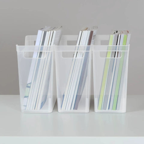 Clear Plastic Shelf Bin Organizer With Open Top Handles For Easy Closet, Cabinet And Pantry Storage Stackable Totes, Narrow Design Fits Standard Shelving, Office And Home Organization 6 Pack displayed on a shelf with books inside.