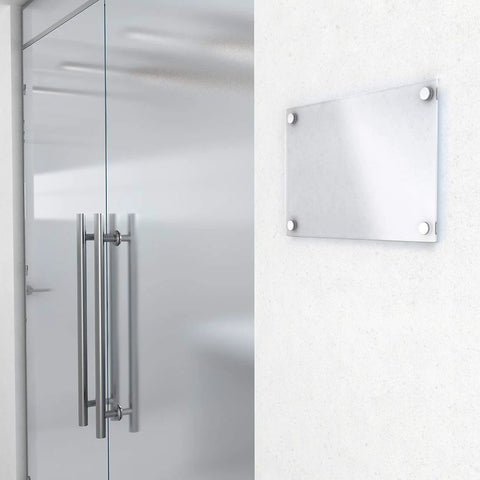 Mirror Screw Decorative Cap Covers 10mm Brushed Stainless Steel Set of 4 installed on glass sign next to metal door in office.