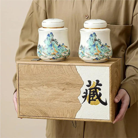 Vintage Airtight Ceramic Double Tea Canisters For Loose Leaf Coffee Beans And Spices on a wooden box, held by a person.