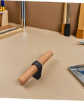Solid Wood Cabinet Handle Black Drawer Pulls With Single Hole on a workspace, showcasing modern flat front design for kitchen use.