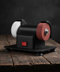 Solid Compact Corded Electric Bench Grinder Tool Polisher Cutter With Dual Wheel Setup on wooden surface, featuring black body.