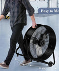 24 Inch Industrial Drum Fan With High Velocity Airflow, Heavy Duty Metal Air Circulator, 3 Speed Settings, person moving fan