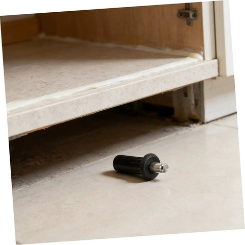Metal Cabinet Door Repair Pins Kit With Spring Loaded Shaft Pins next to open cabinet door on tile floor