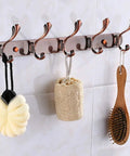Heavy Duty Stainless Steel Wall Coat Rack With Five Sturdy Hooks For Coats Hats Robes And Towels Sleek Rustproof Entryway Organizer with spa accessories.