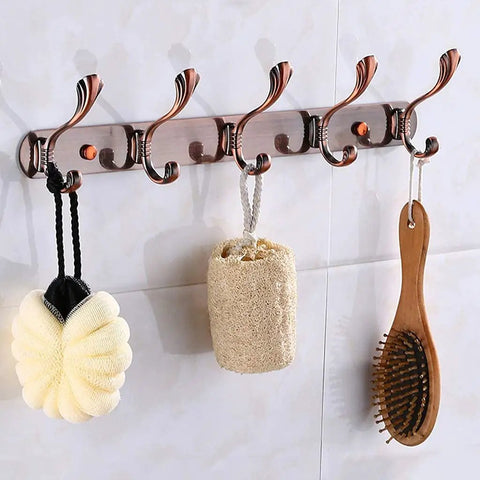 Heavy Duty Stainless Steel Wall Coat Rack With Five Sturdy Hooks For Coats Hats Robes And Towels Sleek Rustproof Entryway Organizer with spa accessories.