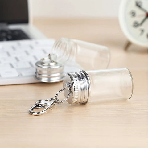 Top Tier 12 Pack 7 ml Mini Glass Bottle Keychains Featuring Secure Screw Lids and Heavy Duty Metal Rings with keyring.