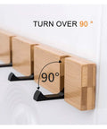 Wall Mounted Nailless Folding Coat Hook Set Featuring Twin Bar Design, showing adjustable hooks, bamboo material for hallway use.