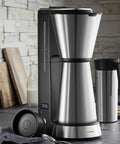 Fully Automatic Bean To Cup Coffee Maker With Integrated Milk Steam Wand in sleek stainless design on kitchen counter.