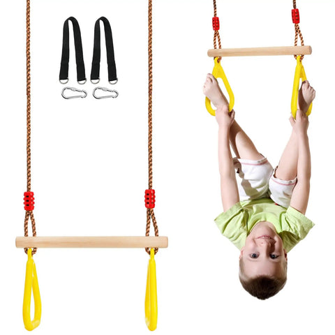 Child playing on 16 Inch Wooden Trapeze Bar With Rings For Swing Sets Adjustable Height From 39 To 67 Inches Gym Hanging Accessories