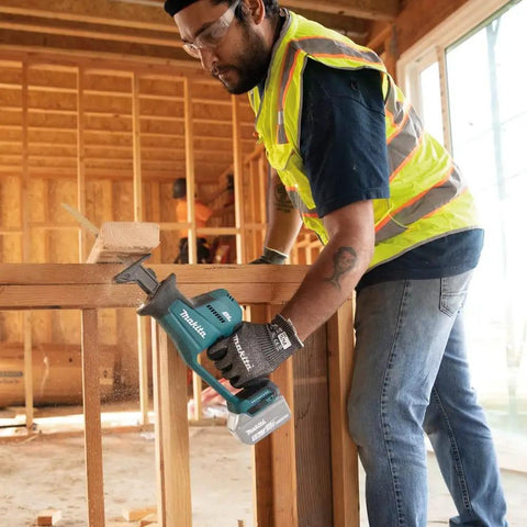 Person using XRJ08Z 18V LXT Brushless Cordless Compact One-Handed Reciprocating Saw Tool Only For Fast Cuts Up To 3,100 SPM in construction